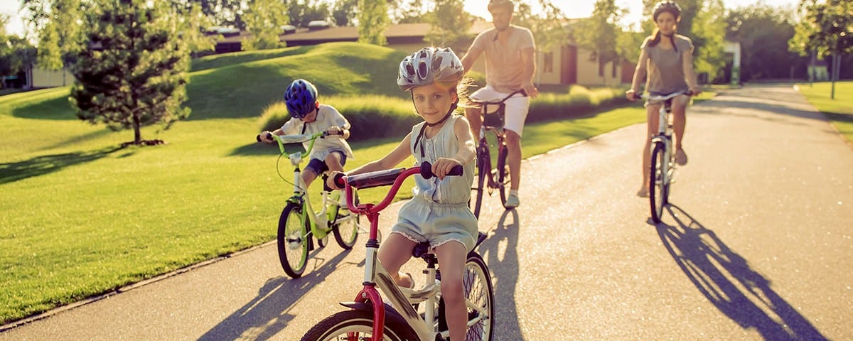 Family riding outdoor bikes